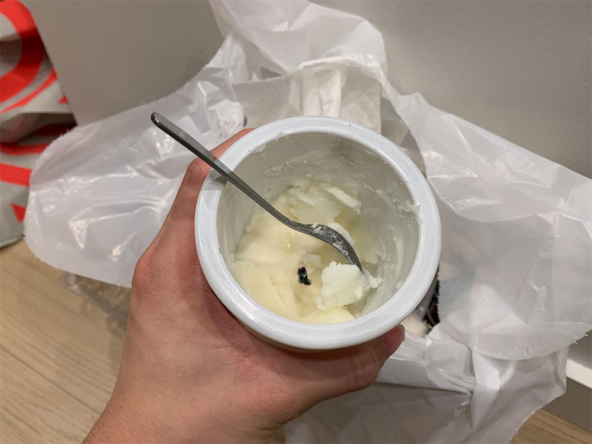 spoon in the candle jar with wax inside