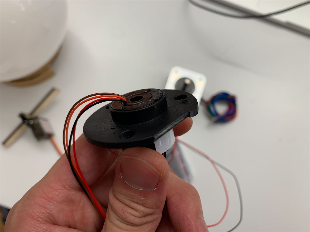 me holding a slip ring with 4 wires